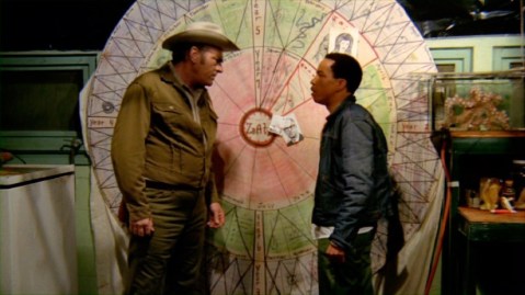 Rex and Sheriff Lou marvel at the Wheel O' Revenge.