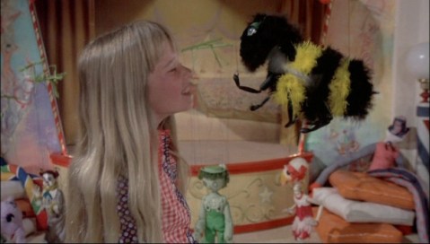 Tia dances with puppets in their room at Bolt's mansion.